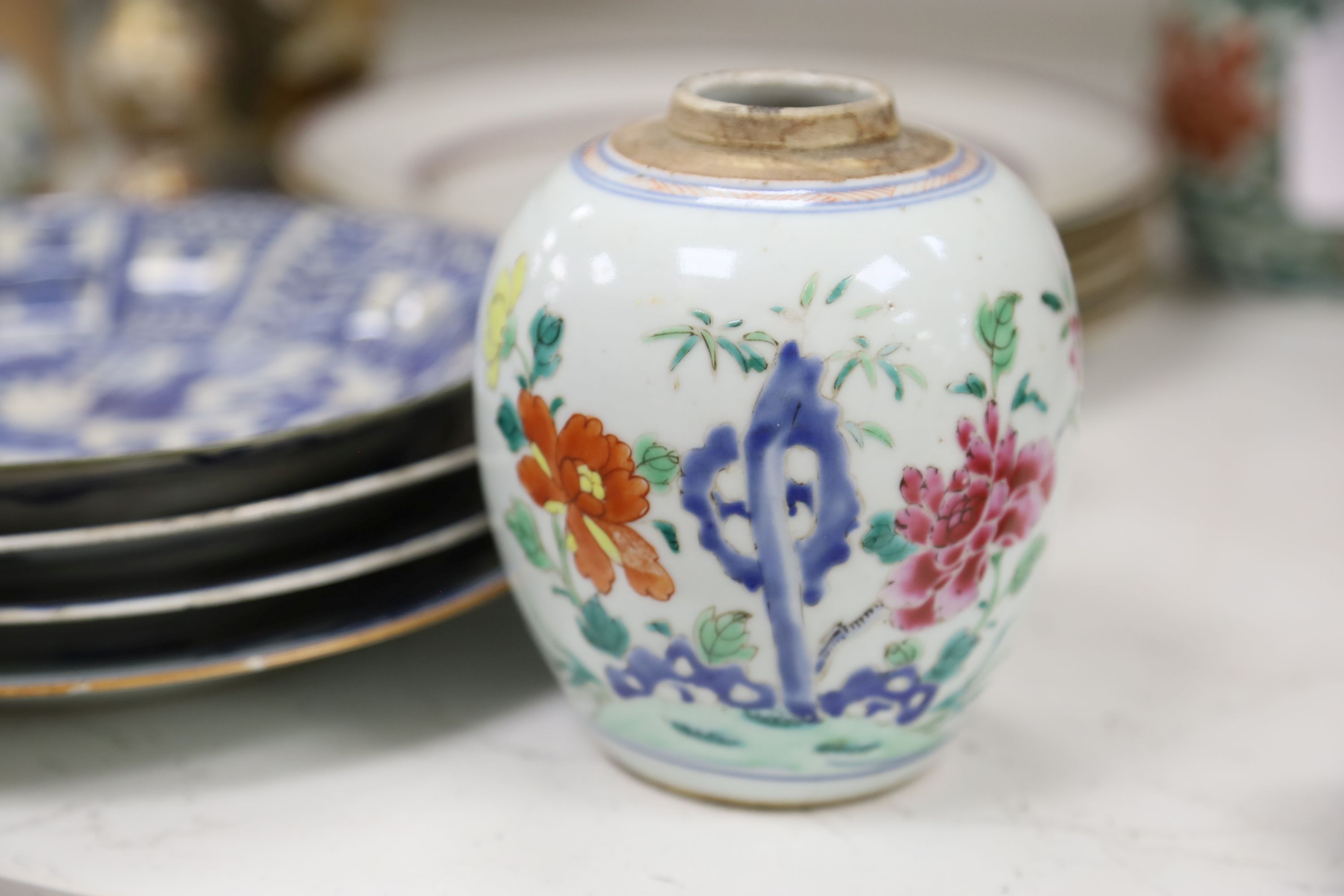 A collection of mixed Asian ceramics, including various Chinese blue and white export plates,